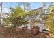 View of back yard featuring a small deck and patio doors to home at 105 Solstice Cir, Cary, NC 27513