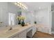 Bright bathroom with dual sinks, soaking tub, and updated fixtures at 105 Solstice Cir, Cary, NC 27513