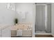 Bathroom featuring a soaking tub with a separate glass-enclosed shower at 105 Solstice Cir, Cary, NC 27513