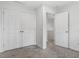 Bedroom with neutral carpet, closet, and an open door showing access to other rooms at 105 Solstice Cir, Cary, NC 27513