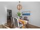 Charming dining area with wood table set for four, complemented by a modern chandelier at 105 Solstice Cir, Cary, NC 27513