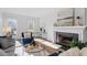 Bright living room features a fireplace, comfortable furniture, and natural light from the surrounding windows at 105 Solstice Cir, Cary, NC 27513