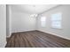 Well-lit dining room with wood flooring and a modern chandelier at 1100 Freestone Rd, Durham, NC 27703