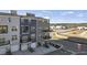 Modern townhome featuring blue and gray siding, balconies, and individual garages, creating a stylish and functional exterior at 1241 S Blount Street # 201, Raleigh, NC 27601