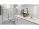 Modern bathroom featuring double sinks, a walk-in shower, and neutral finishes at 1308 White Verona Way, Knightdale, NC 27545