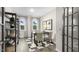 Bright office featuring modern decor, a desk, a comfortable chairs, a bookcase, and large windows at 1308 White Verona Way, Knightdale, NC 27545