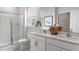 Beautiful bathroom with double sink vanity, modern fixtures and a large glass enclosed shower at 1312 White Verona Way, Knightdale, NC 27545