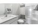 Well-lit bathroom featuring shower and tub combo, single sink vanity, and modern finishes at 1312 White Verona Way, Knightdale, NC 27545