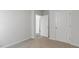 The bedroom features neutral walls and carpet, and 2 white doors at 1312 White Verona Way, Knightdale, NC 27545