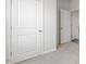 The bedroom features neutral walls and carpet, and a white closet door at 1312 White Verona Way, Knightdale, NC 27545