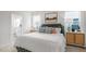Relaxing main bedroom offers a plush bed, stylish nightstands, and large bright windows at 1312 White Verona Way, Knightdale, NC 27545