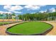 This community playground has green grass, trees and new constuction homes nearby at 1312 White Verona Way, Knightdale, NC 27545