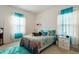 Bright and airy bedroom with large windows, a comfortable bed, and a cozy rug at 1610 Stone Rd, Durham, NC 27703