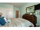 Bedroom with ample closet space, plants, and decor at 1610 Stone Rd, Durham, NC 27703