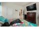 Comfortable bedroom featuring carpeted floors, a large bed, and access to an ensuite bathroom at 1610 Stone Rd, Durham, NC 27703