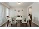Stylish dining room with wood floors, a large table with chairs, and decorative wall accents at 1610 Stone Rd, Durham, NC 27703