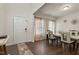 Bright dining room featuring wood floors, a white table with chairs and decorative wall art at 1610 Stone Rd, Durham, NC 27703