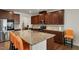 A spacious kitchen with a large granite island, stainless steel appliances, and modern cabinetry at 1610 Stone Rd, Durham, NC 27703