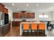 Kitchen with a large island, granite counters, stainless steel appliances, and a modern aesthetic at 1610 Stone Rd, Durham, NC 27703