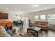 Bright living room with hardwood floors, comfortable seating, and a dining area bathed in natural light at 1610 Stone Rd, Durham, NC 27703