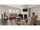 A well-lit living room with a cozy fireplace, plush seating, and a warm, inviting atmosphere at 1610 Stone Rd, Durham, NC 27703