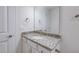 Bathroom featuring a single sink, granite counters, white cabinets, and brushed nickel hardware at 1749 Daiquiri Turn, Sanford, NC 27332
