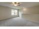 Spacious bonus room with neutral carpet and a large window for natural light at 1749 Daiquiri Turn, Sanford, NC 27332