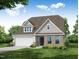 Charming two-story home featuring a brick facade, landscaped yard, and an attached two-car garage at 1749 Daiquiri Turn, Sanford, NC 27332