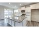 Kitchen island features a granite countertop, stainless steel faucet, and white cabinets at 1749 Daiquiri Turn, Sanford, NC 27332