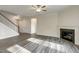 Spacious living room with fireplace, staircase and wood-look flooring at 1749 Daiquiri Turn, Sanford, NC 27332