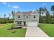 Two story home with neutral siding, a two car garage, a covered front porch and professionally landscaped yard at 181 Cribbs Ln, Middlesex, NC 27557