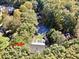 View of a lovely home nestled among mature trees in a quiet cul-de-sac at 206 Steep Bank Dr, Cary, NC 27518