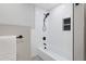 Bathroom showcasing a bathtub and shower with black fixtures and a tiled niche at 206 Steep Bank Dr, Cary, NC 27518
