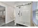 Bathroom showcasing a glass-enclosed shower with white subway tile and patterned floor at 206 Steep Bank Dr, Cary, NC 27518