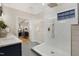 This is a marble bathroom with a frameless glass shower and modern fixtures at 206 Steep Bank Dr, Cary, NC 27518