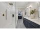 This bathroom has marble floors and a clear shower enclosure at 206 Steep Bank Dr, Cary, NC 27518