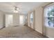 Spacious bedroom featuring multiple windows, soft carpet, and ample closet space at 206 Steep Bank Dr, Cary, NC 27518