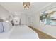 This bedroom is brightly lit and shows the ensuite bathroom at 206 Steep Bank Dr, Cary, NC 27518