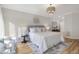 This is a bright bedroom with hardwood floors and accent furniture at 206 Steep Bank Dr, Cary, NC 27518