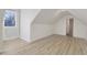 Bright bedroom featuring laminate flooring and a window at 206 Steep Bank Dr, Cary, NC 27518