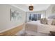 This bedroom has a bed and a view of the backyard and outdoor foliage at 206 Steep Bank Dr, Cary, NC 27518