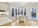 Charming dining area with large windows providing ample natural light and backyard view at 206 Steep Bank Dr, Cary, NC 27518