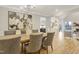 Dining room with a long, rustic table, seating for ten, and natural light at 206 Steep Bank Dr, Cary, NC 27518