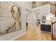 Elegant foyer with wood-look flooring, artwork, and views into the adjoining living and dining areas at 206 Steep Bank Dr, Cary, NC 27518