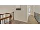 Hallway with wood railings and carpeted floors at 206 Steep Bank Dr, Cary, NC 27518