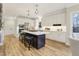Bright kitchen boasting a large island with seating and modern stainless steel appliances at 206 Steep Bank Dr, Cary, NC 27518