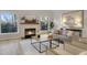 Inviting living room with fireplace, natural light, and neutral color palette at 206 Steep Bank Dr, Cary, NC 27518