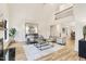 Spacious living room with vaulted ceiling, fireplace, and an open layout perfect for entertaining at 206 Steep Bank Dr, Cary, NC 27518