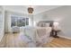 Serene main bedroom with a large window, sitting area, and plush decor at 206 Steep Bank Dr, Cary, NC 27518