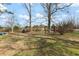 Backyard with trees, offering a large space for recreation at 245 Cedar Crk Rd, Franklinton, NC 27525